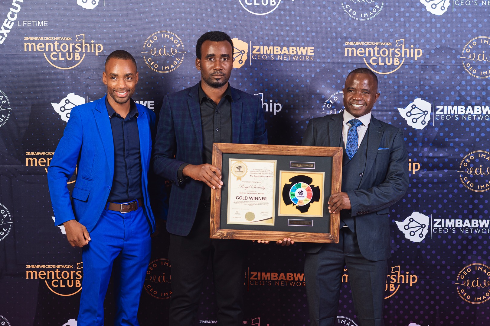 Rogel Security executives posing with a gold winner award