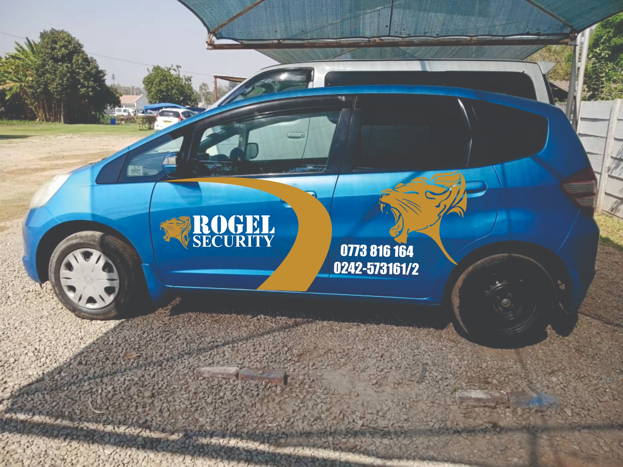 Blue Rogel Security branded patrol vehicle